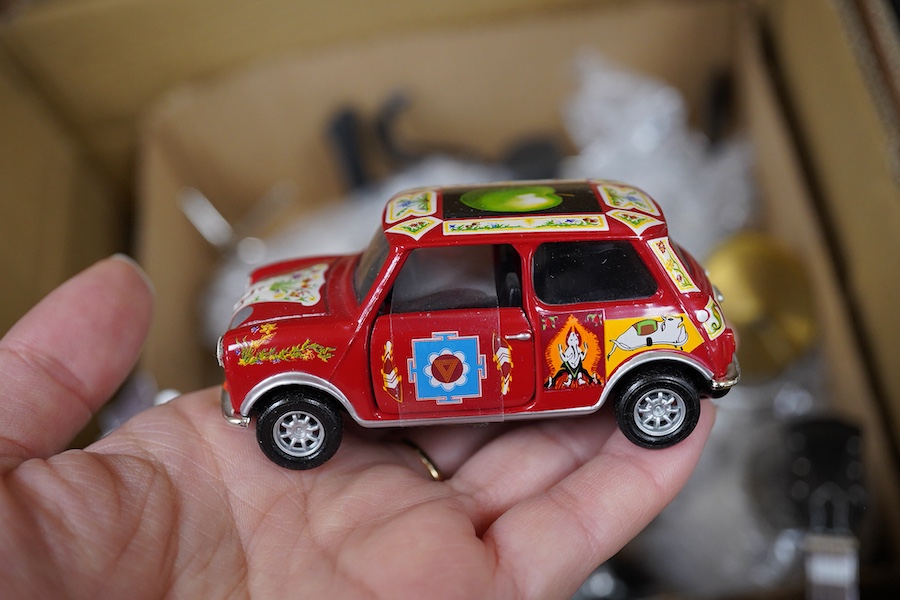 A collection of Beatles memorabilia including; models of a Beatles drum kit and eight miniature guitars and stands, each approx 25cm long, together with three boxed Corgi Beatles related models, including the Yellow Subm